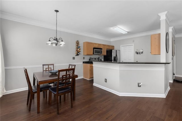 dining room featuring dark hardwood / wood-style flooring, crown molding, and an inviting chandelier