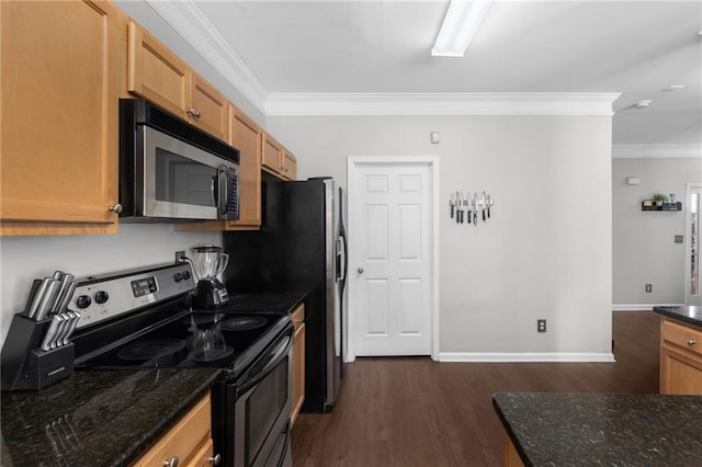 kitchen with crown molding, stainless steel appliances, and dark stone counters