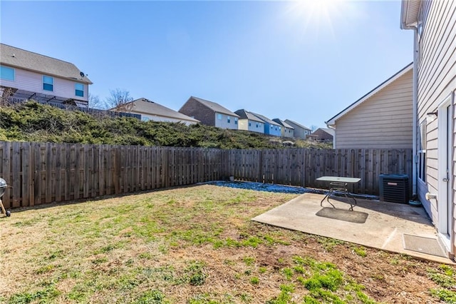 view of yard featuring a patio and central AC unit