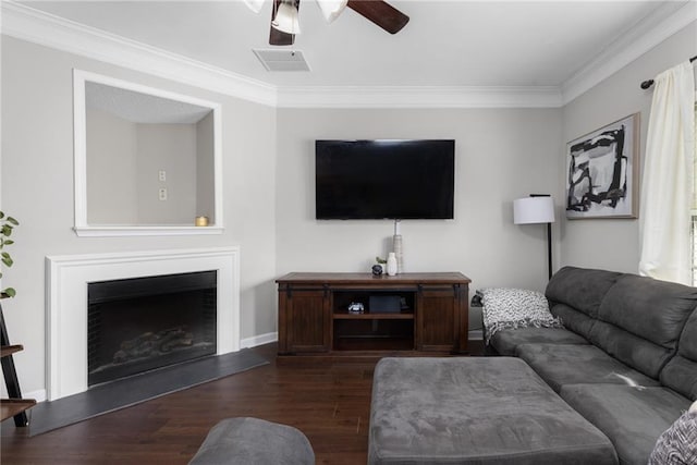 living room featuring ornamental molding, dark hardwood / wood-style floors, and ceiling fan