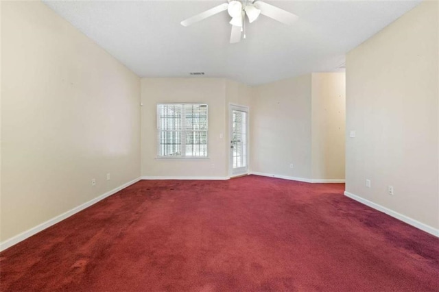 unfurnished room with ceiling fan and carpet flooring