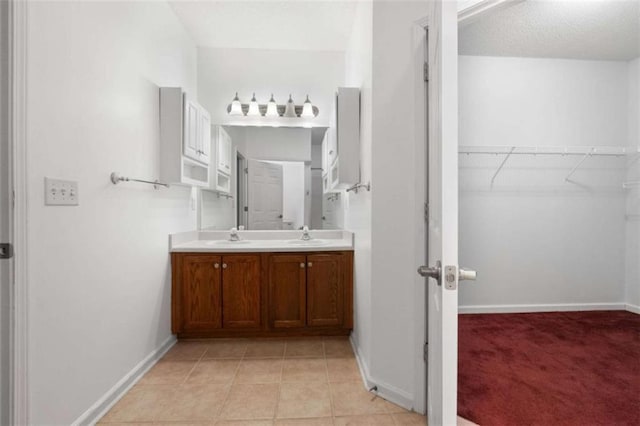 bathroom with vanity and tile patterned flooring