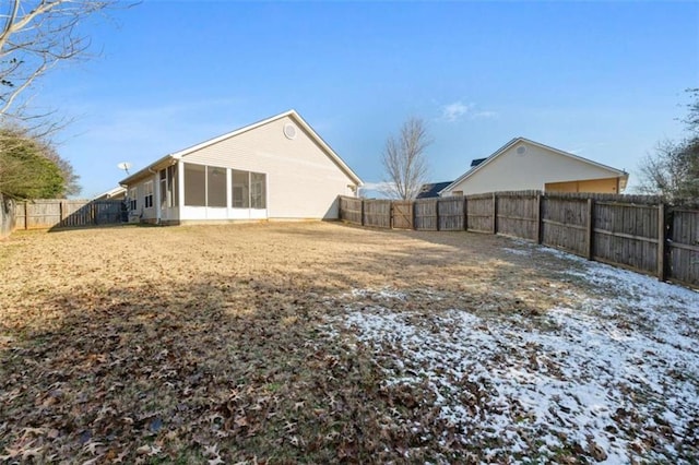 view of yard with a sunroom