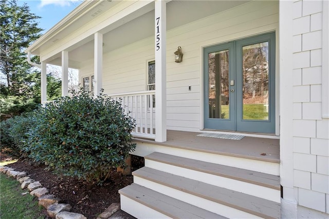 view of front of home featuring a front lawn, fence, covered porch, concrete driveway, and an attached garage