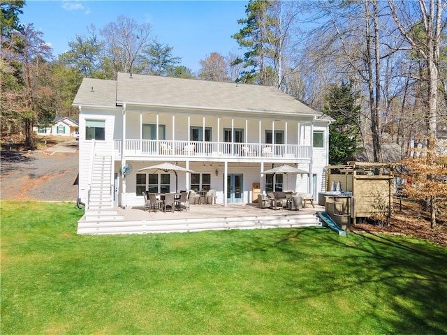 deck with outdoor dining space and an outdoor living space with a fire pit