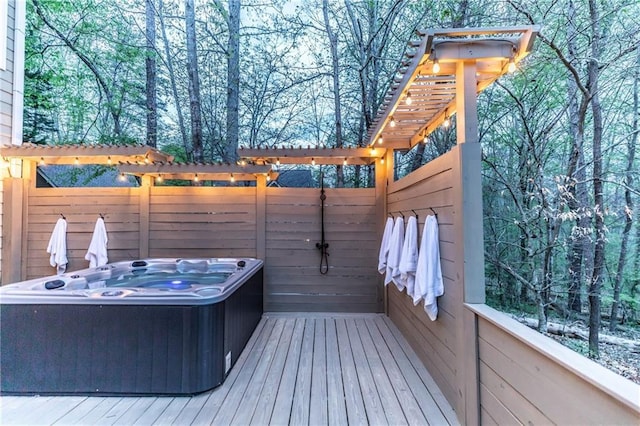 wooden terrace with a hot tub