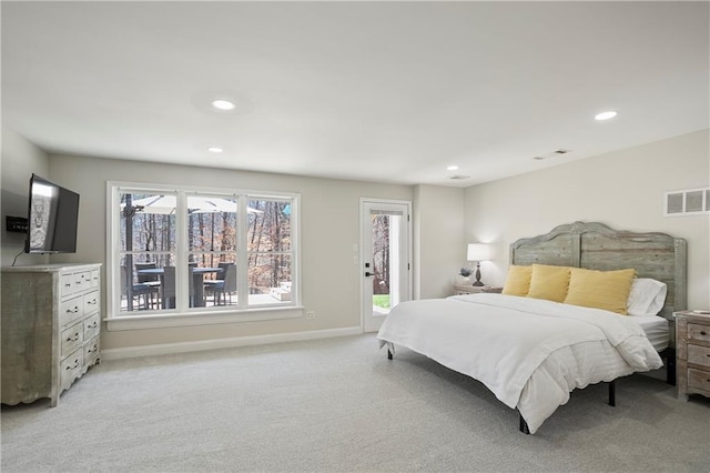 doorway to outside with light carpet, recessed lighting, and baseboards