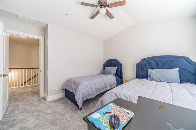 bedroom with lofted ceiling, light carpet, and ceiling fan