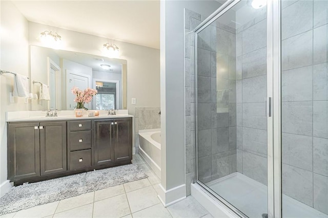 bathroom with tile patterned flooring, vanity, and separate shower and tub