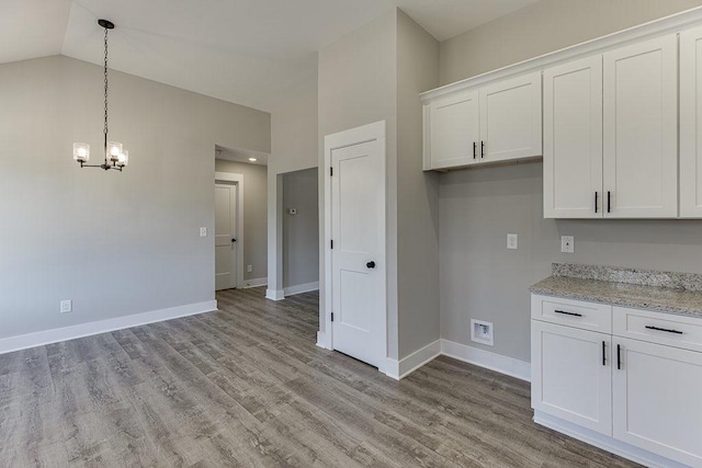 kitchen featuring white cabinetry and light wood finished floors