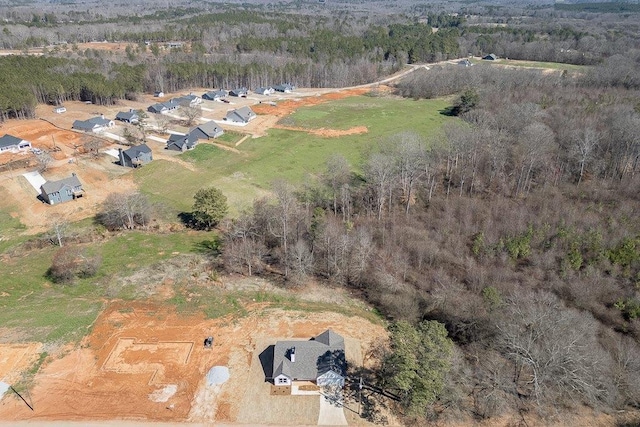 aerial view featuring a wooded view