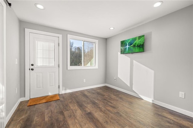 entrance foyer with dark hardwood / wood-style floors and a barn door