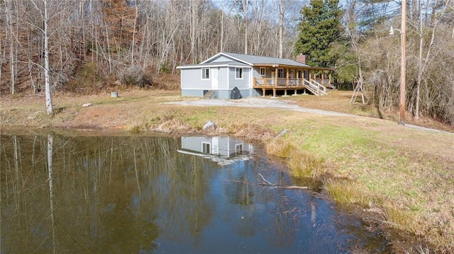 back of house featuring a water view