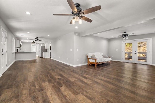 unfurnished room with french doors, dark hardwood / wood-style flooring, and ceiling fan