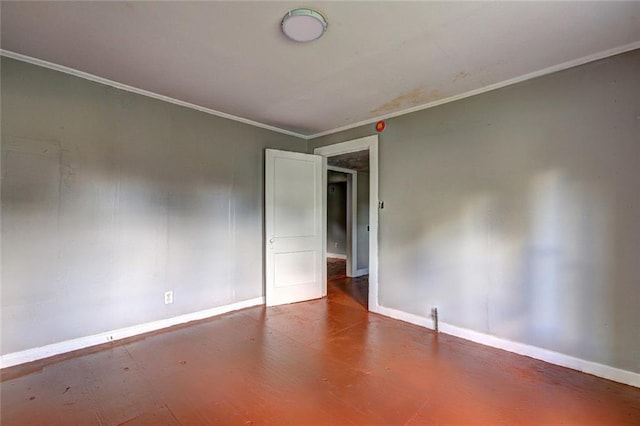unfurnished room with baseboards and crown molding