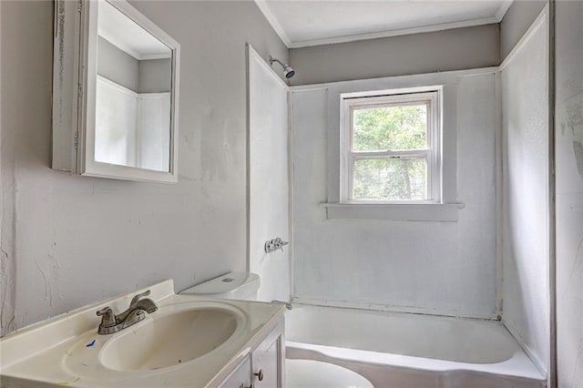 bathroom featuring toilet, vanity, crown molding, and shower / bathtub combination