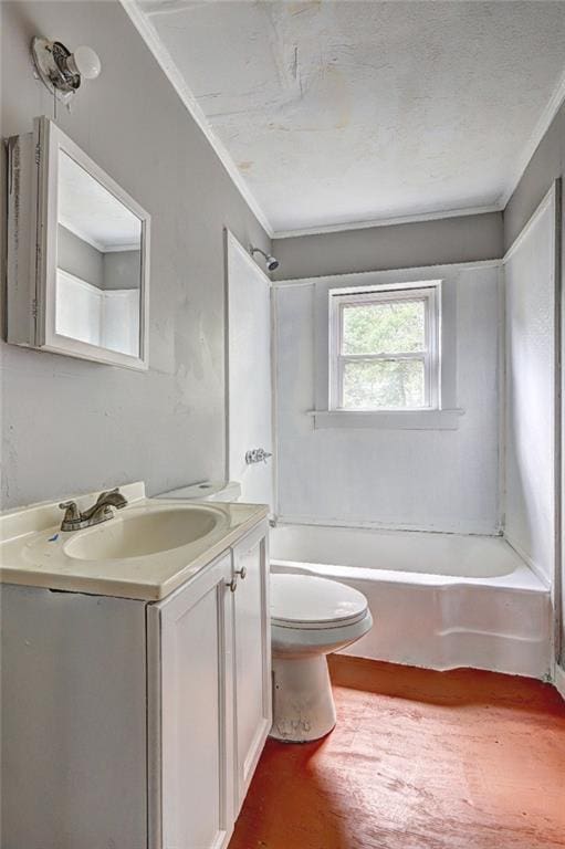 bathroom featuring toilet, crown molding, vanity, and washtub / shower combination