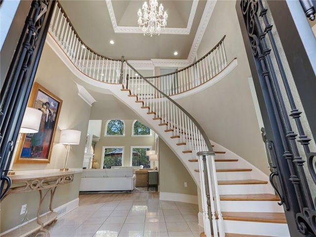 entrance foyer with a notable chandelier, a high ceiling, and light tile patterned floors