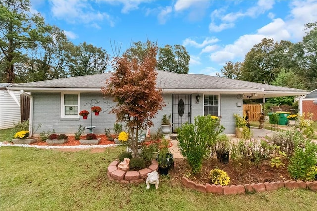 ranch-style home with a front lawn