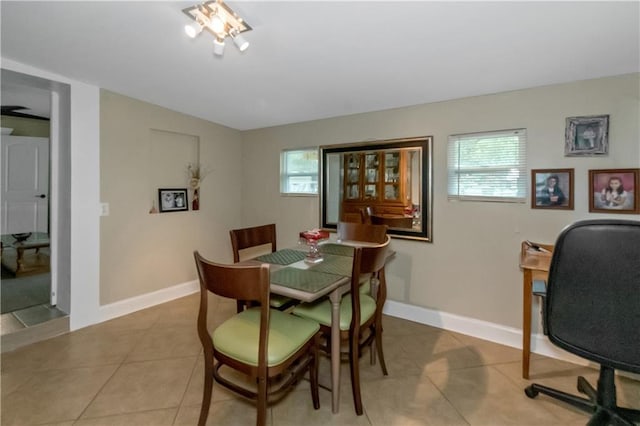 dining area with a healthy amount of sunlight and light tile patterned floors