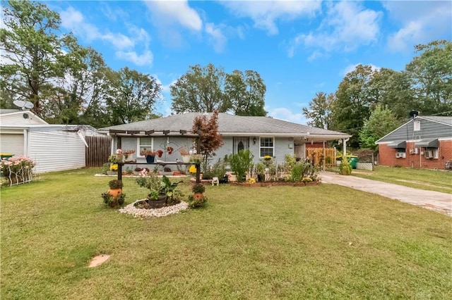 ranch-style home featuring a carport and a front lawn