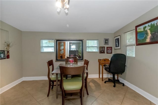 tiled dining space with a wealth of natural light