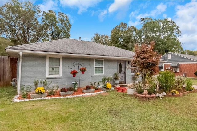 single story home with a front yard