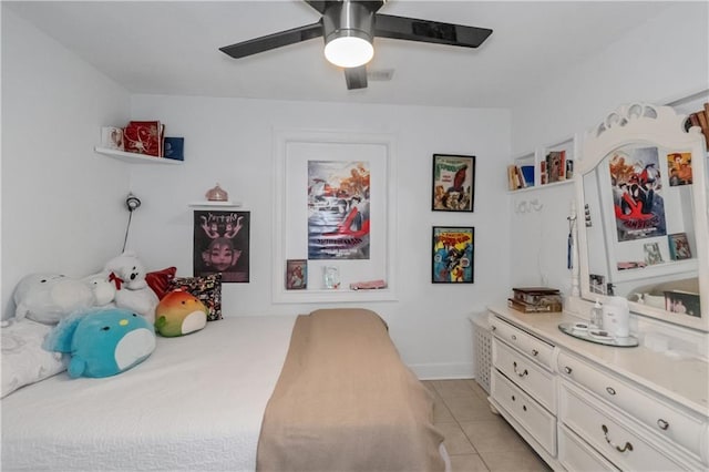 bedroom with ceiling fan and light tile patterned floors