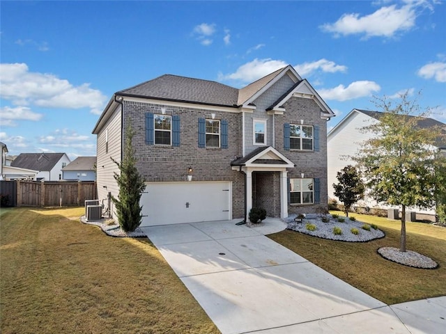 view of front of property featuring a front yard and a garage