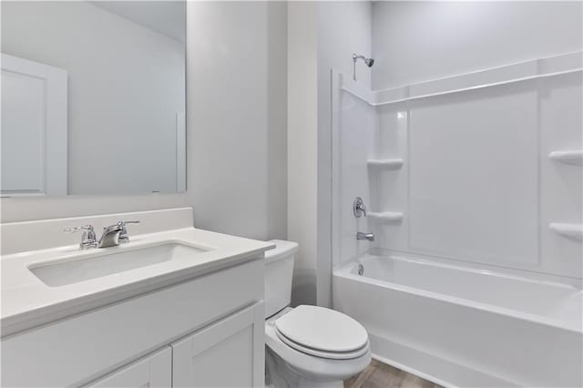 650 Cayenne Way, Lawrenceville, GA 30045 - bathroom with vanity, toilet, shower / tub combination, and wood finished floors