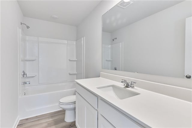 650 Cayenne Way, Lawrenceville, GA 30045 - full bathroom with vanity, wood finished floors, toilet, and shower / bath combination