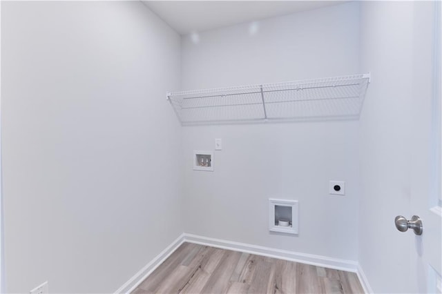 650 Cayenne Way, Lawrenceville, GA 30045 - laundry area with electric dryer hookup, washer hookup, light wood finished floors, and baseboards