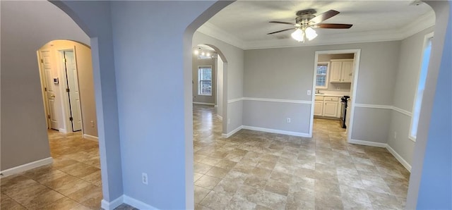 1230 Chris Lake Dr, Lawrenceville, GA 30046 - unfurnished room with a ceiling fan, arched walkways, crown molding, baseboards, and stone finish floors