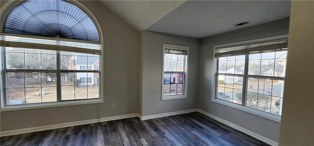 1230 Chris Lake Dr, Lawrenceville, GA 30046 - empty room with dark wood finished floors, baseboards, and lofted ceiling