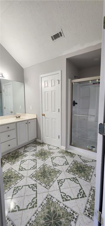 1230 Chris Lake Dr, Lawrenceville, GA 30046 - bathroom featuring vanity, a shower stall, lofted ceiling, baseboards, and tile patterned floors