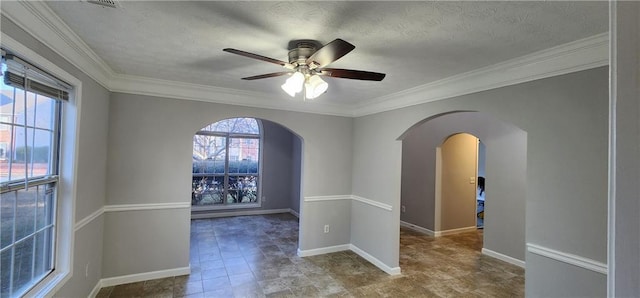 1230 Chris Lake Dr, Lawrenceville, GA 30046 - unfurnished room featuring arched walkways, ornamental molding, ceiling fan, baseboards, and a textured ceiling