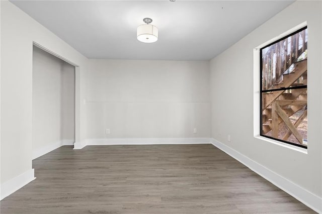 unfurnished room featuring wood-type flooring