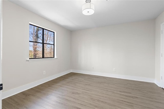 spare room featuring dark hardwood / wood-style floors