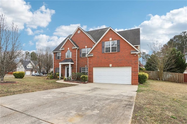 front of property featuring a garage and a front yard