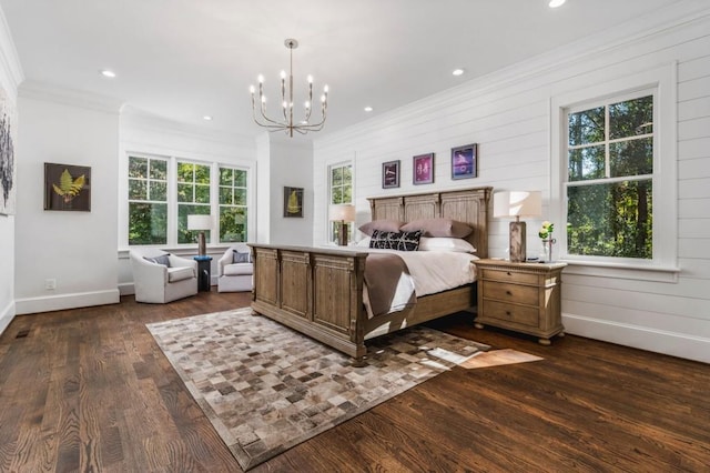 bedroom featuring crown molding, wooden walls, a notable chandelier, and dark hardwood / wood-style flooring