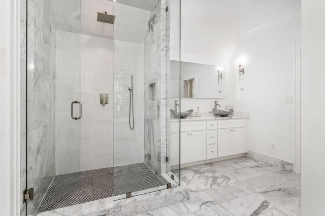 bathroom with vanity, ornamental molding, and walk in shower