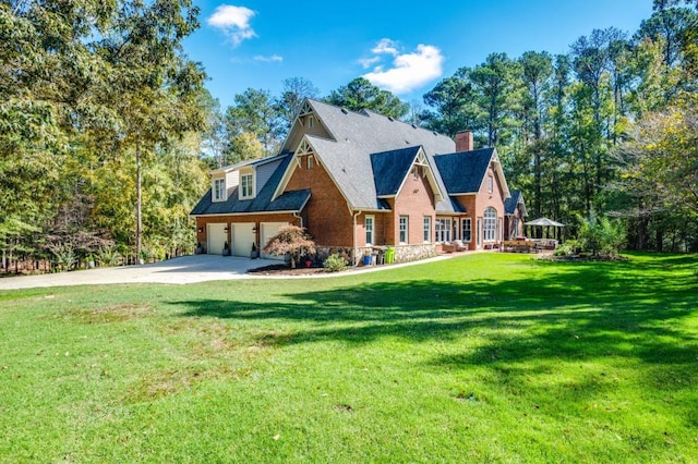 view of front facade with a front yard and a garage