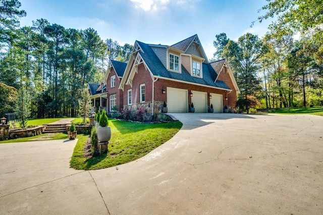 view of side of home featuring a yard and a garage