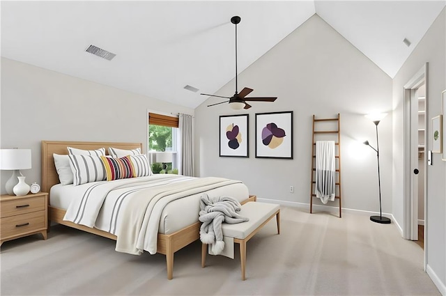 bedroom with high vaulted ceiling, baseboards, and light colored carpet