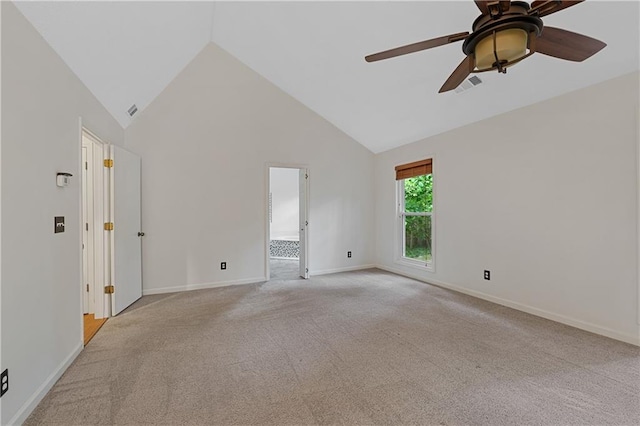 unfurnished room featuring light colored carpet, ceiling fan, high vaulted ceiling, and baseboards