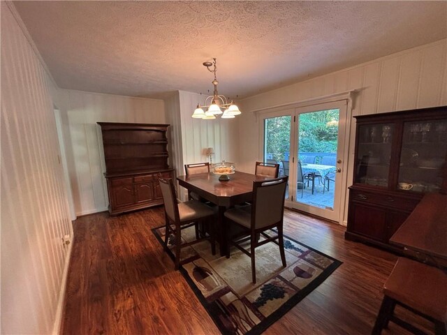 4519 Sims Ct, Tucker, GA 30084 - dining room with a textured ceiling, dark wood finished floors, and an inviting chandelier