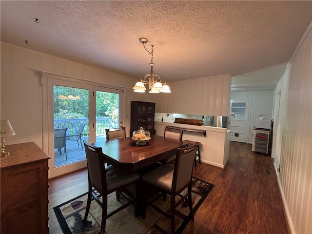 4519 Sims Ct, Tucker, GA 30084 - dining room with an inviting chandelier, a textured ceiling, and dark wood-type flooring