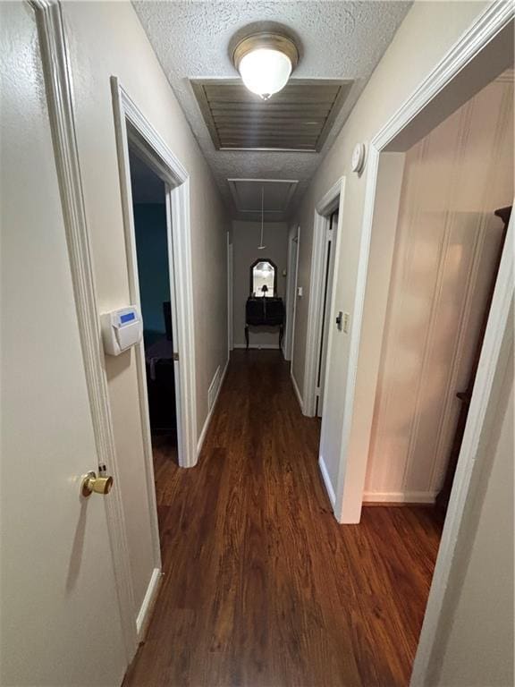 4519 Sims Ct, Tucker, GA 30084 - hallway with visible vents, baseboards, attic access, a textured ceiling, and dark wood finished floors