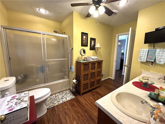 4519 Sims Ct, Tucker, GA 30084 - bathroom featuring toilet, a textured ceiling, a sink, and wood finished floors