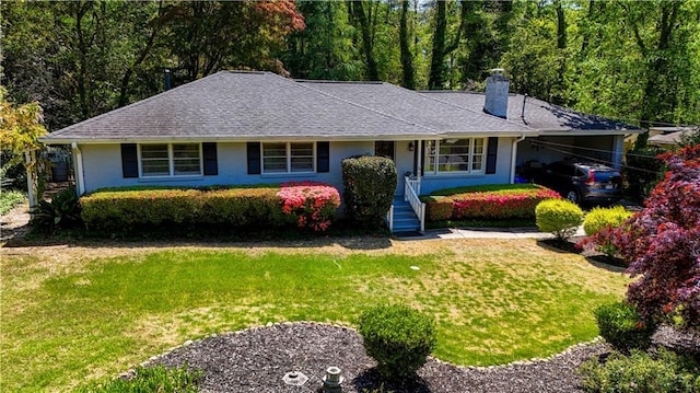 4519 Sims Ct, Tucker, GA 30084 - ranch-style home with a shingled roof, a chimney, an attached carport, and a front lawn